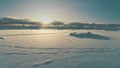 Sunrise above arctic snow covered surface top view