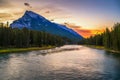 Sunrise above Bow River and Mount Rundle from Banff Pedestrian Bridge in Canada Royalty Free Stock Photo