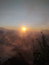 Sunrise Above the Clouds from a Mountain Peak in Indonesia Royalty Free Stock Photo