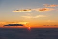 Sunrise above clouds and warm sky. Royalty Free Stock Photo