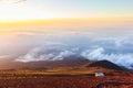 Sunrise above clouds and warm sky.