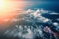 Sunrise above fluffy clouds, top view from airplane window, dramatic atmosphere landscape Royalty Free Stock Photo