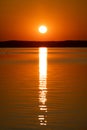 Sunrise above horizon forest at lake