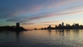 Sunrise above Manhattan, New York, NY - View across Hudson River from Pier A Park in Hoboken, NJ. Royalty Free Stock Photo