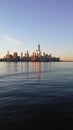 Sunrise above Manhattan, New York, NY - View across Hudson River from Pier A Park in Hoboken, NJ. Royalty Free Stock Photo