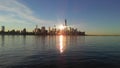 Sunrise above Manhattan, New York, NY - View across Hudson River from Pier A Park in Hoboken, NJ. Royalty Free Stock Photo