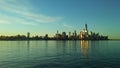 Sunrise above Manhattan, New York, NY - View across Hudson River from Pier A Park in Hoboken, NJ. Royalty Free Stock Photo