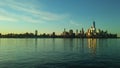 Sunrise above Manhattan, New York, NY - View across Hudson River from Pier A Park in Hoboken, NJ. Royalty Free Stock Photo