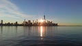 Sunrise above Manhattan, New York, NY - View across Hudson River from Pier A Park in Hoboken, NJ. Royalty Free Stock Photo