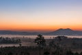 Sunrise above the mountain and misty forest on the morning.