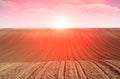 Sunrise above plowed field morning farmland