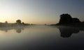 Sunrise above a river on foggy summer morning, the sky reflections in the water,  misty reflection in steaming water, Royalty Free Stock Photo