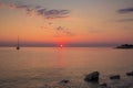 Sunrise in the adriatic sea with little boat Royalty Free Stock Photo