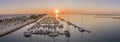 Sunrise aerial seascape view of Olhao salt marsh Inlet, waterfront to Ria Formosa natural park. Algarve.