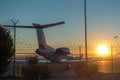 Sunrise at the airport with barbed wire security fence and jetlined