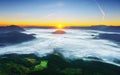 Sunrise in Aramaio valley with morning fog