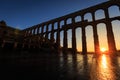 Sunrise between the arches of the Aqueduct of Segovia, Segovia Royalty Free Stock Photo