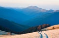 Sunrise autumn mountain road view. Royalty Free Stock Photo