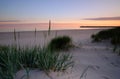Sunrise on the Baltic Sea coast, sand dunes, beach, Kolobrzeg, Poland. Royalty Free Stock Photo