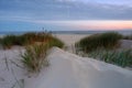 Sunrise on the Baltic Sea coast, sand dunes, beach, Kolobrzeg, Poland. Royalty Free Stock Photo