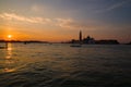 Sunrise in the bay of San Marco overlooking the Cathedral of San Giorgio Maggiore. Venice, Italy Royalty Free Stock Photo