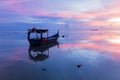 Sunrise by the beach with boat in George Town, Penang Malaysia