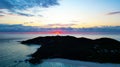 Sunrise at a beach with a lighthouse in the distance: Byron Bay, Australia Royalty Free Stock Photo