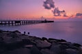 Sunrise in beach long exposure middle of bridge Royalty Free Stock Photo