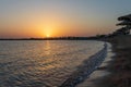 Sunrise on the beach with parasol overlooking the Red Sea in Hurghada, Egypt Royalty Free Stock Photo