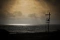 Silhouette of lifeguard chair at sunrise Royalty Free Stock Photo