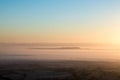 Sunrise on a beautiful frosty, misty morning. Looking down on layers of fog across the Engliseh countrysid