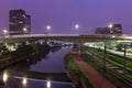 Beginning of the day in metropolis, bright lights and vehicles in transit. Sao Paulo city highway and bridge beside the