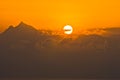 Sunrise behind clouds at holy mountain Athos