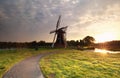 Sunrise behind Dutch windmill Royalty Free Stock Photo