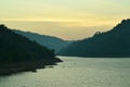 Sunrise behind mountain on river in Thailand Royalty Free Stock Photo