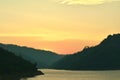 Sunrise behind mountain on river in Thailand Royalty Free Stock Photo