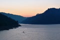 Sunrise behind mountain on river in Thailand Royalty Free Stock Photo