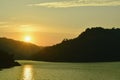 Sunrise behind mountain on river in Thailand Royalty Free Stock Photo