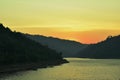 Sunrise behind mountain on river in Thailand Royalty Free Stock Photo