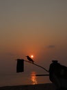 Sunrise bird boat and sea and u r there to capture the moment