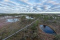 Sunrise in the bog. Icy cold marsh. Frosty ground. Swamp lake and nature. Freeze temperatures in moor. Muskeg natural environment.