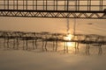 Sunrise, bridge and waves