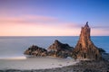 Sunrise in the Cabo de Gata Natural Park. Basaltic rock formation on the beach.