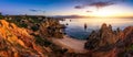 Sunrise at Camilo beach in Lagos, Algarve, Portugal. Wooden footbridge to the beach Praia do Camilo, Portugal. Picturesque view of Royalty Free Stock Photo