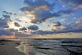 Sunrise on the Caribbean. The rays of the rising sun break through the clouds