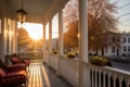 sunrise casting light on a greek revival houses faceted porch