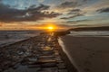 Sunrise at a chilly Cullercoats Bay in the north east of England, with Tynemouth Pier and the lighthouse in the distance Royalty Free Stock Photo