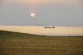 Sunrise with clouds on the ocean with a fishing Royalty Free Stock Photo