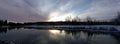 Sunrise cloudy skies sunrise over a reflecting pond