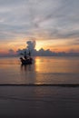 A fishing boat with sunrise